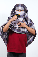 thief wearing holster takes black credit card with surprised expression isolated on white background