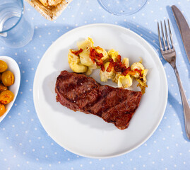 Homemade veal steak with grilled artichokes, healthy dinner
