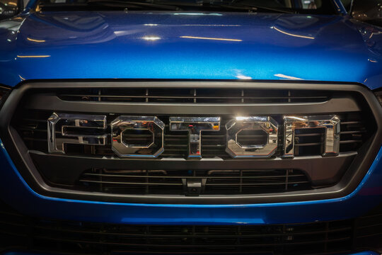BELGRADE, SERBIA - MARCH 15, 2025: Foton loo on a metallic-blue pickup at a car dealership of Belgrade. Part of Beiqi Foton Motor, Foton is a chinese car and automotive manufacturer.