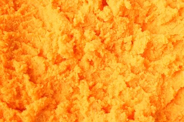 Tasty orange sorbet as background, closeup view