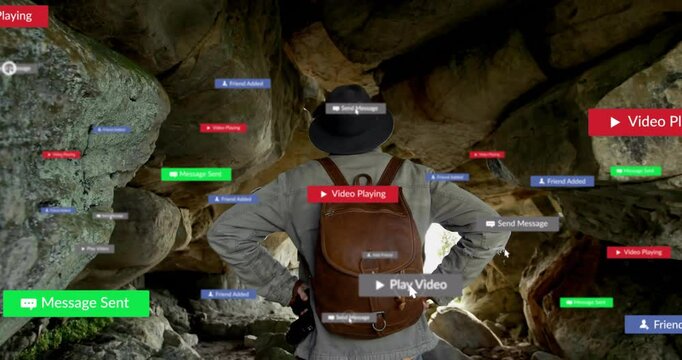man exploring cave, interacting with floating tech chat bubbles, banners and play buttons