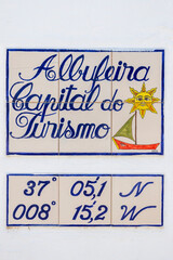 Azulejo sign with coordinates in Albufeira