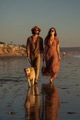 A couple strolling on the beach with their dog during the golden hour, creating a romantic moment.