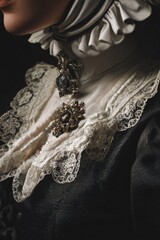 Obraz premium An elegant detail shot highlights vintage lace and intricate, ornate jewelry, with dramatic lighting.