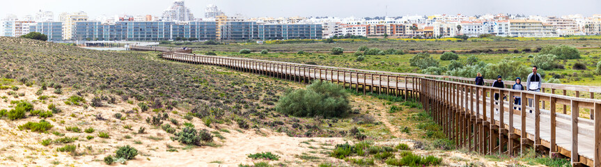 Large apartment complex near sand dunes