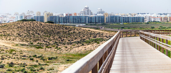 Large apartment complex near sand dunes
