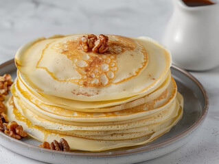 Stack of pancakes with walnuts and honey
