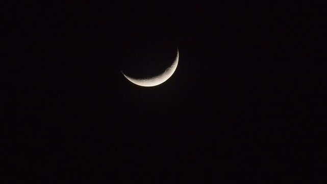 waxing crescent moon in spring night sky
