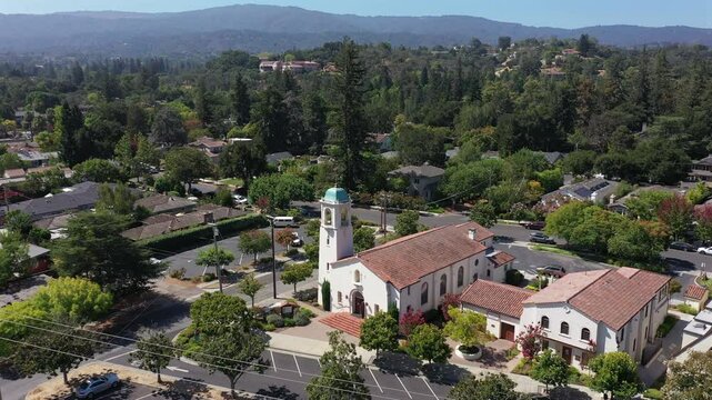 Daytime view of a historic church and cityscape of downtown Los Altos, California, USA.