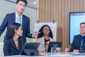 multiracial business team at work together,prepare for board meeting to analyze and discuss the situation on the financial report in the office