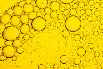 Macro close up of yellow drink bubbles,Fresh lemon slice in water with bubbles on white background,close up of the beer