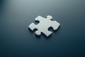 Obraz premium Single white puzzle piece on dark background (1)