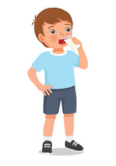 Little boy drinking a glass of milk 