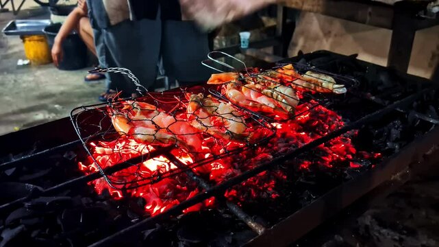 rilled shrimp on wire rack over hot charcoal at street market