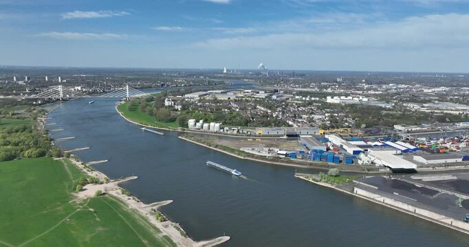 Rhine river, industrial ruhr region, shipping waterway for industrial transport. Infrastructure, Trade and industry in Germany. Aerial view.
