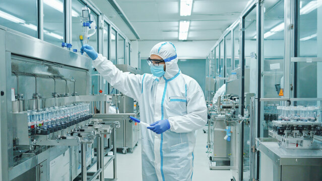 High-tech pharmaceutical laboratory, close-up of a scientist in full PPE using precision instruments to measure active compounds, sterile and futuristic environment. - Powered by Adobe