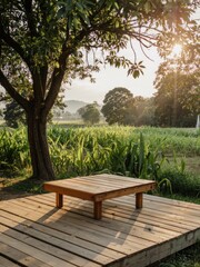 Obraz premium Tranquil Wooden Deck with a Bench Beneath a Tree, Overlooking a Cornfield at Golden Hour
