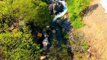 A view of a valley in early summer colored with green light. A beautiful natural view of Sillim, Gangwon Province, Korea's attraction, taken with a drone in the sky. A trip to Gangwon Province
