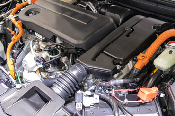 Fototapeta premium focused on the automotive industry within the contemporary new automobile engine room, machine displays all components and has an open hood. the new car's engine compartment.