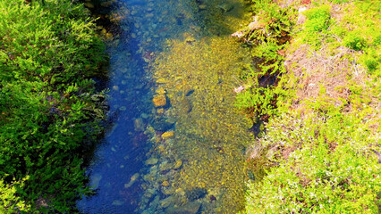 A view of a valley in early summer colored with green light. A beautiful natural view of Sillim, Gangwon Province, Korea's attraction, taken with a drone in the sky. A trip to Gangwon Province