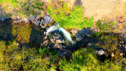A view of a valley in early summer colored with green light. A beautiful natural view of Sillim, Gangwon Province, Korea's attraction, taken with a drone in the sky. A trip to Gangwon Province