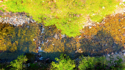 A view of a valley in early summer colored with green light. A beautiful natural view of Sillim, Gangwon Province, Korea's attraction, taken with a drone in the sky. A trip to Gangwon Province
