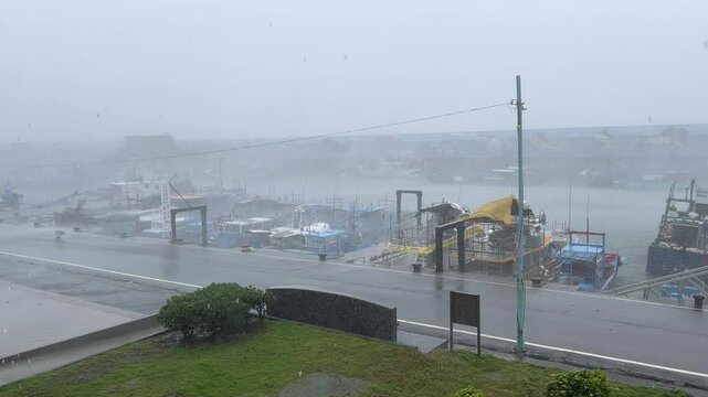 Debris Flies Down Road In Strong Hurricane Winds - Haikui