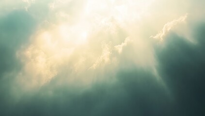 Fototapeta premium Sunbeams pierce through dramatic, dark clouds