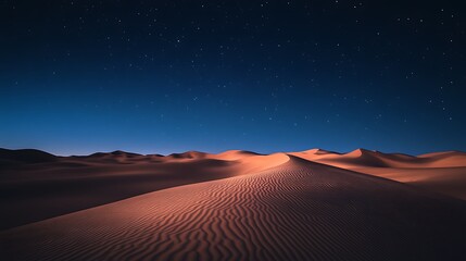 Vast desert dunes under a starlit night sky.