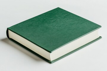 Green book, hard cover, resting on a white surface