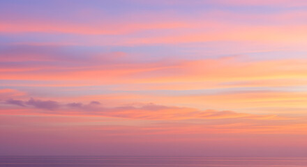 Fototapeta premium Pastel Sunset Hues over Calm Ocean Horizon