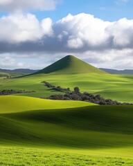 Picturesque rolling hills under a partly cloudy sky