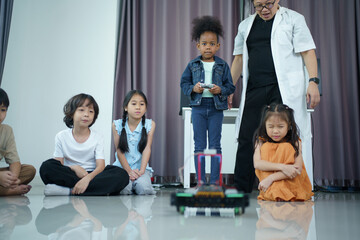 Group of diverse children enjoy learning about the STEM.