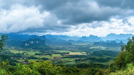 Fototapeta premium Panoramic landscape view of a valley with dramatic sky.