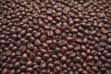 Obraz premium A mound of dark roasted coffee beans isolated on white , coffee shop, heap