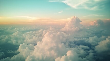 A calming image of clouds from above with a soft, dreamy aesthetic.