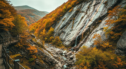 cascading waterfall in autumnal mountain landscape