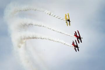 Bi Planes performing stunts in the air