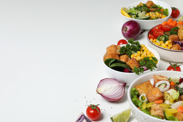 Fried tofu salad with vegetables on a light background