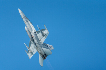 F18 Super Hornet performing maneuvers in the sky