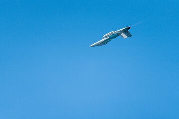 F18 Super Hornet performing maneuvers in the sky