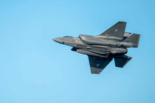 F35 flying through the air at airshow - Powered by Adobe