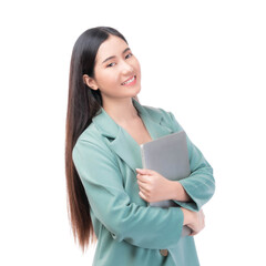 Fototapeta premium A confident young businesswoman with long dark hair, wearing a teal blazer, holding a closed laptop and smiling isolated on a transparent background