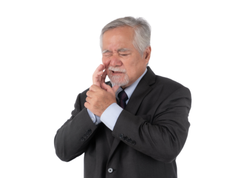 A senior Asian businessman in a dark suit, experiencing severe toothache and holding his cheek isolated on a transparent background