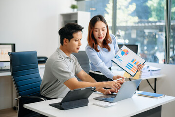 Female discussing new project with male colleague. Young woman talking in office