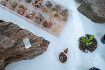 In the laboratory, research equipment rests on the table as scientists analyze rock samples, using...
