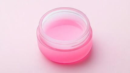 Open container filled with pink colored cosmetic product in it