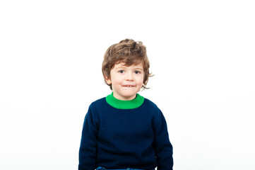 Boy in blue sweater smiles brightly