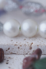 Elegant pearl beads on textured surface with vibrant accents