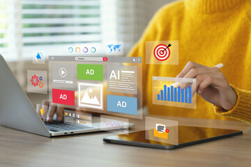 Online advertising concept, Digital Marketing Strategies and Goals. Women using a laptop to analyze...